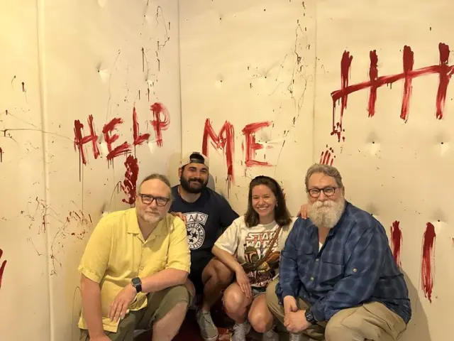 Winning escape room team celebrating at PanIQ Boston