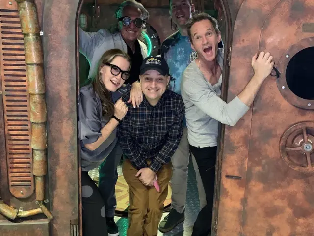 Escape room crew with victory signs