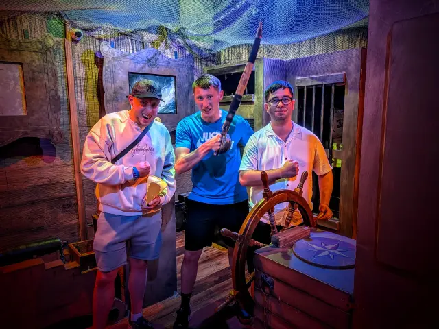 Team photo inside a themed escape room