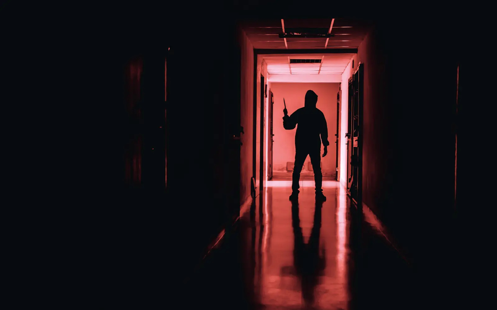 Dimly lit escape room corridor at PanIQ Room Boston